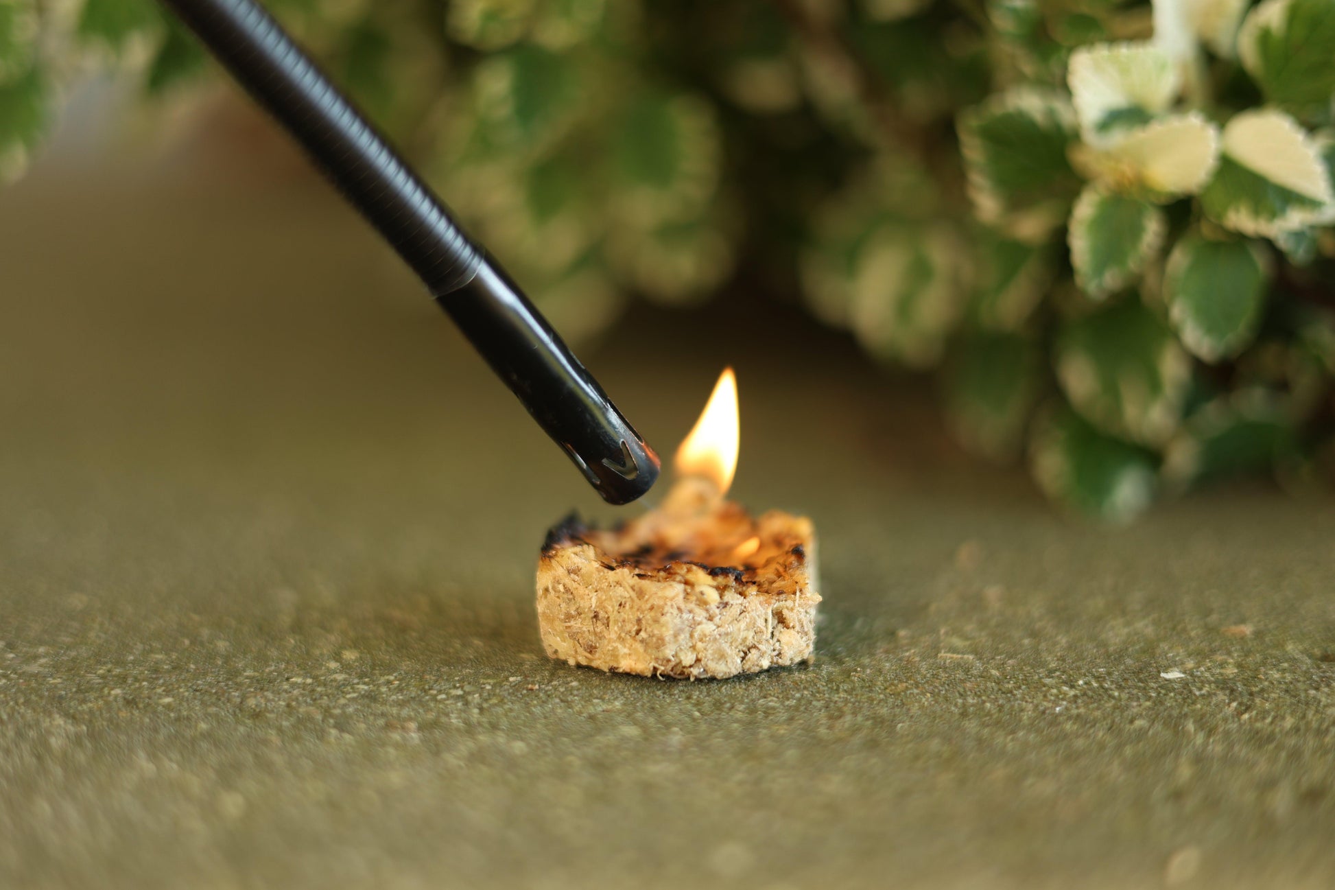 Handmade eco-friendly hexagon beeswax fire starter made with recycled sawdust, pine shavings, and beeswax for a sustainable fire-lighting solution