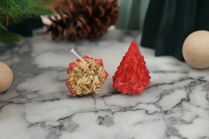 Red geometric Christmas tree fire starters made from beeswax and recycled wood materials, perfect for starting fires without toxic chemicals as we use candle-safe dye