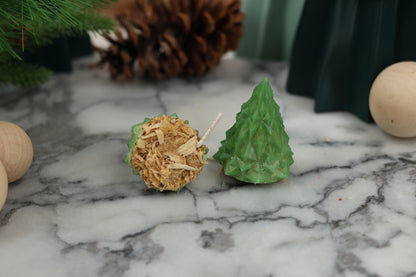 Green geometric Christmas tree fire starters made from beeswax and recycled wood materials, perfect for starting fires without toxic chemicals as we use candle-safe dye